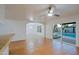 Spacious living room features tile floors with easy access to the kitchen and outdoor pool at 3054 W Redfield Rd, Phoenix, AZ 85053