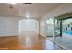 Spacious living room with tile floors and sliding glass doors to the backyard at 3054 W Redfield Rd, Phoenix, AZ 85053