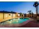 Backyard with a private pool, mature landscaping, and seamless connection to the home's interior spaces at 3054 W Redfield Rd, Phoenix, AZ 85053