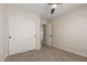 Bedroom featuring a ceiling fan and a closet with sliding doors, offering storage at 33287 N Windmill Run, San Tan Valley, AZ 85144