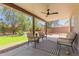 Covered patio area with a ceiling fan and comfortable seating, perfect for relaxing at 33287 N Windmill Run, San Tan Valley, AZ 85144