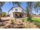 Two-story home showcasing a covered patio, backyard, and fresh landscaping at 33287 N Windmill Run, San Tan Valley, AZ 85144
