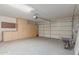 Spacious garage with ample storage cabinets and an automatic door opener at 33287 N Windmill Run, San Tan Valley, AZ 85144