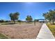 Community sand volleyball court featuring trees, shade structures, and a sidewalk at 33287 N Windmill Run, San Tan Valley, AZ 85144