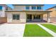 Well-maintained backyard with covered patio and artificial grass at 3361 E Wisteria Pl, Chandler, AZ 85286