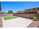 Backyard with stone patio area and artificial turf rectangles at 3361 E Wisteria Pl, Chandler, AZ 85286