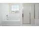 Bright bathroom with a soaking tub and a separate glass-enclosed shower at 3361 E Wisteria Pl, Chandler, AZ 85286
