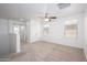 Empty bedroom with carpet, a ceiling fan, and an abundance of natural light from multiple windows at 3361 E Wisteria Pl, Chandler, AZ 85286