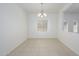 Open dining room featuring tile floors, neutral colors and a modern light fixture at 3361 E Wisteria Pl, Chandler, AZ 85286