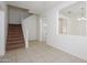 Welcoming entryway with tiled floors, carpeted stairs, and natural light at 3361 E Wisteria Pl, Chandler, AZ 85286