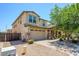 Charming two-story home featuring a stone facade, well-maintained landscaping, and a two-car garage at 3361 E Wisteria Pl, Chandler, AZ 85286