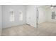 Bright foyer with tile flooring, three windows, and doorway leading to another room at 3361 E Wisteria Pl, Chandler, AZ 85286