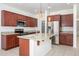 Modern kitchen featuring stainless steel appliances, granite countertops, and a spacious center island at 3361 E Wisteria Pl, Chandler, AZ 85286
