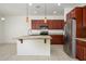 Bright kitchen features granite counters, stainless appliances, and a large island at 3361 E Wisteria Pl, Chandler, AZ 85286