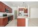 Spacious kitchen with stainless steel appliances, granite countertops, and a walk-in pantry at 3361 E Wisteria Pl, Chandler, AZ 85286