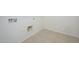 Bright laundry room with tile flooring and essential hookups at 3361 E Wisteria Pl, Chandler, AZ 85286