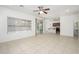 Open-concept living area with tile floors, and easy access to kitchen and backyard at 3361 E Wisteria Pl, Chandler, AZ 85286