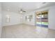 Spacious living room with tile floors, recessed lighting, and a sliding glass door at 3361 E Wisteria Pl, Chandler, AZ 85286