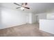 Comfortable carpeted loft area with a ceiling fan for air circulation at 3361 E Wisteria Pl, Chandler, AZ 85286