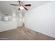 Spacious loft area featuring neutral carpet and ceiling fan at 3361 E Wisteria Pl, Chandler, AZ 85286