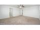 Spacious bedroom featuring a ceiling fan and access to an en-suite bathroom and walk-in closet at 3361 E Wisteria Pl, Chandler, AZ 85286