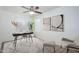 Bright office space with carpet, a ceiling fan, modern desk and chair, and plenty of light at 3361 E Wisteria Pl, Chandler, AZ 85286