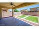 Covered patio overlooking a low maintenance backyard with artificial turf at 3361 E Wisteria Pl, Chandler, AZ 85286
