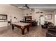A spacious billiards room with adjacent kitchenette and comfortable seating at 3825 E Camelback Rd # 290, Phoenix, AZ 85018