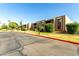 View of building exterior with manicured landscaping, a lush green lawn, and easy access parking at 3825 E Camelback Rd # 290, Phoenix, AZ 85018