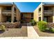 Exterior of complex with desert landscaping, gravel, stone accents, and stair access at 3825 E Camelback Rd # 290, Phoenix, AZ 85018