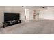 Spacious living room featuring gray carpeting and flat screen tv at 3825 E Camelback Rd # 290, Phoenix, AZ 85018