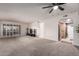 Spacious living room featuring gray carpeting and natural light at 3825 E Camelback Rd # 290, Phoenix, AZ 85018