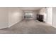 Spacious living room with gray carpeting and sliding glass doors at 3825 E Camelback Rd # 290, Phoenix, AZ 85018