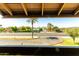Scenic street view of the lush landscaped median and neighborhood architecture at 3825 E Camelback Rd # 290, Phoenix, AZ 85018