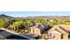 Stunning aerial view of home showcasing lush landscaping, golf course views, and a tranquil neighborhood at 40619 N Candlewyck Ln, Phoenix, AZ 85086