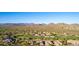 Scenic aerial view of a community with golf course and mountain views at 40619 N Candlewyck Ln, Phoenix, AZ 85086