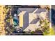 Aerial view of the backyard featuring a private pool, covered patio, outdoor seating area, and mature desert landscaping at 40619 N Candlewyck Ln, Phoenix, AZ 85086