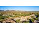 Scenic aerial view of a community with golf course and mountain views at 40619 N Candlewyck Ln, Phoenix, AZ 85086