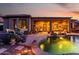Inviting backyard showcasing a shimmering pool, covered patio, and ample seating for relaxing and entertaining guests at 40619 N Candlewyck Ln, Phoenix, AZ 85086
