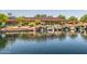 Picturesque Daisy Mountain Railroad feature with a charming waterfall cascading into a serene lake at 40619 N Candlewyck Ln, Phoenix, AZ 85086