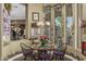 Charming dining area with a round table, comfortable seating, and decorative accents with bright natural light at 40619 N Candlewyck Ln, Phoenix, AZ 85086
