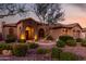 Charming home exterior showcasing a beautifully landscaped front yard and welcoming entrance at 40619 N Candlewyck Ln, Phoenix, AZ 85086