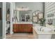 Luxurious main bathroom with a soaking tub, dual sink vanity, and ample natural light at 40619 N Candlewyck Ln, Phoenix, AZ 85086