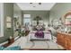 Spacious main bedroom featuring plush bedding, hardwood floors, custom shelving, and natural lighting at 40619 N Candlewyck Ln, Phoenix, AZ 85086