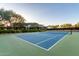 Enjoy a match on the well-maintained tennis court, surrounded by lush greenery, at the community clubhouse at 40619 N Candlewyck Ln, Phoenix, AZ 85086