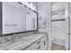 Bright bathroom featuring a double vanity with a granite countertop and a separate shower area at 4332 E Boston St, Gilbert, AZ 85295