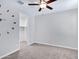 Bedroom featuring light walls, carpet, a ceiling fan, and a closet at 4332 E Boston St, Gilbert, AZ 85295
