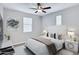 Cozy bedroom with neutral tones, soft carpet, ceiling fan, and stylish decor at 4332 E Boston St, Gilbert, AZ 85295