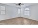 Bright and spacious bedroom with neutral walls, tile flooring, and ample natural light from large windows at 4332 E Boston St, Gilbert, AZ 85295