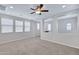Spacious bonus room illuminated by recessed lighting and natural light through large windows at 4332 E Boston St, Gilbert, AZ 85295